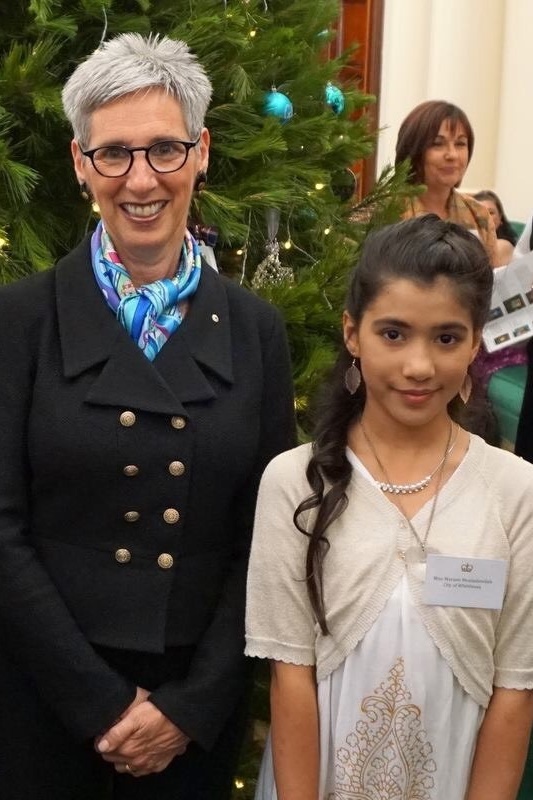 Mariam with the Honourable Linda Dessau AM, Governor of Victoria.